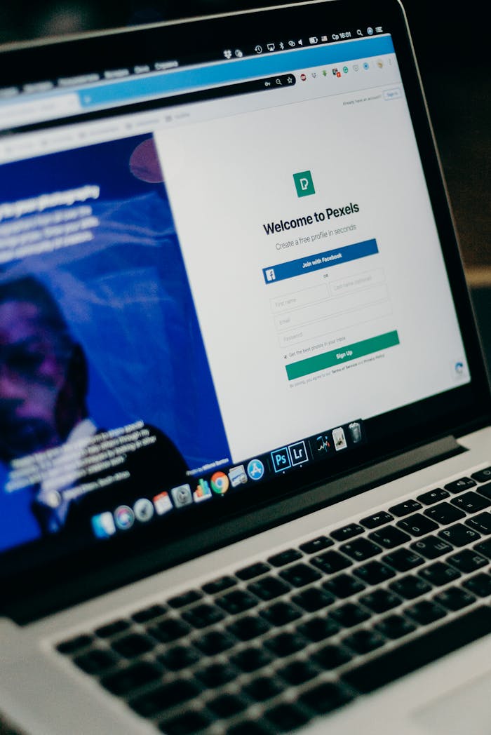 services-04 Close-up view of a laptop displaying a sign-up page for an online platform.