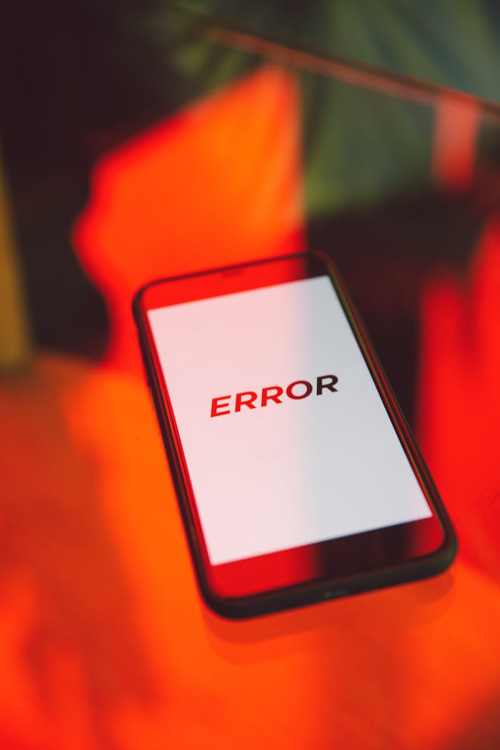Mastering the First Impression: Your intriguing post title goes here A close-up view of a smartphone showing an error message against a vibrant red background, symbolizing tech issues.